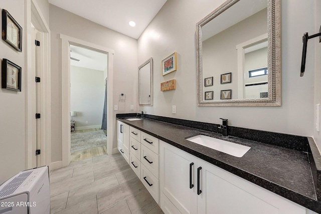 26112 N 7th Ave, Phoenix, AZ 85085 - bathroom featuring double vanity, baseboards, and recessed lighting