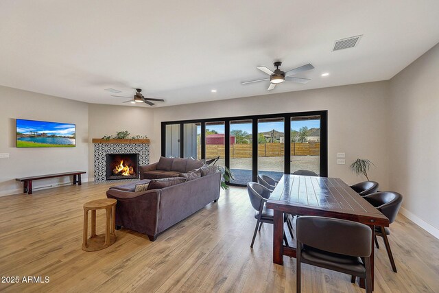 26112 N 7th Ave, Phoenix, AZ 85085 - living area featuring ceiling fan, light wood-style floors, a fireplace, recessed lighting, and baseboards