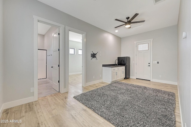 26112 N 7th Ave, Phoenix, AZ 85085 - unfurnished living room with ceiling fan, plenty of natural light, light wood-type flooring, baseboards, and recessed lighting