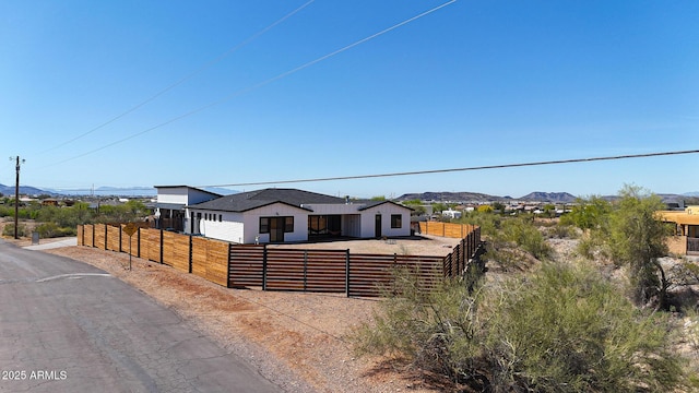 26112 N 7th Ave, Phoenix, AZ 85085 - view of front of house with a fenced front yard and a mountain view