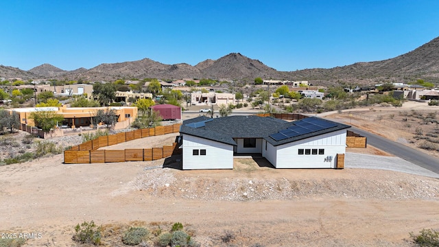 26112 N 7th Ave, Phoenix, AZ 85085 - view of front facade with a mountain view, solar panels, board and batten siding, and a residential view