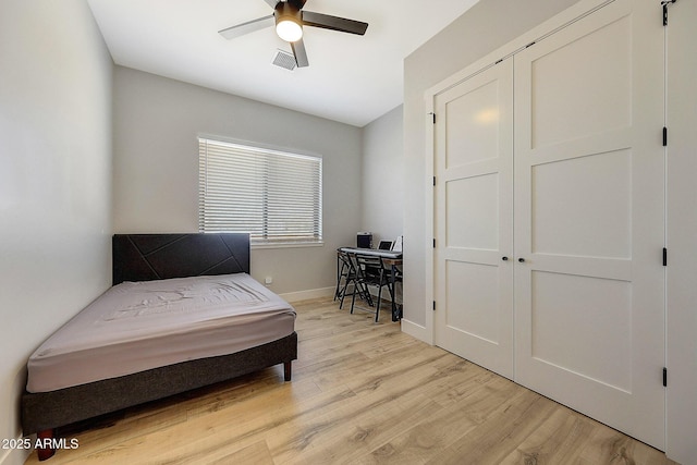 26112 N 7th Ave, Phoenix, AZ 85085 - bedroom with light wood-style floors, baseboards, a desk, and a closet