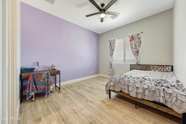 26112 N 7th Ave, Phoenix, AZ 85085 - bedroom featuring wood finished floors, baseboards, and a ceiling fan