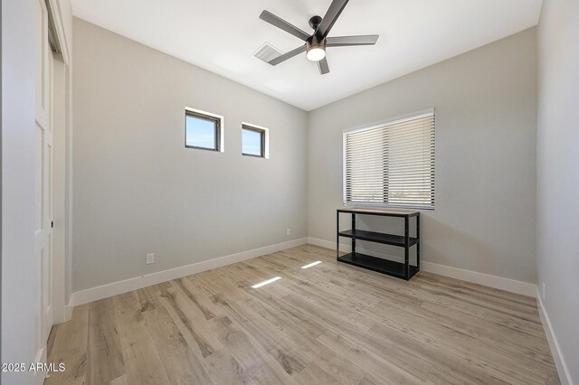 26112 N 7th Ave, Phoenix, AZ 85085 - unfurnished room with ceiling fan, light wood finished floors, and baseboards