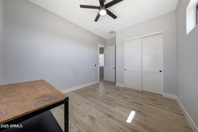 26112 N 7th Ave, Phoenix, AZ 85085 - unfurnished office featuring a ceiling fan, light wood-type flooring, and baseboards