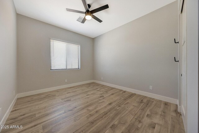 26112 N 7th Ave, Phoenix, AZ 85085 - spare room with light wood finished floors, ceiling fan, and baseboards