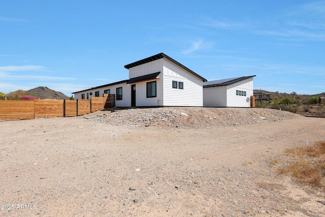 26112 N 7th Ave, Phoenix, AZ 85085 - back of house featuring board and batten siding and metal roof