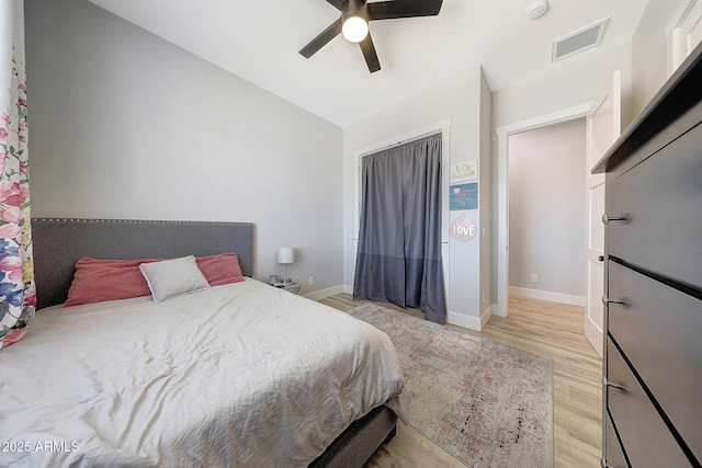 26112 N 7th Ave, Phoenix, AZ 85085 - bedroom featuring light wood-style flooring, baseboards, vaulted ceiling, ceiling fan, and a closet