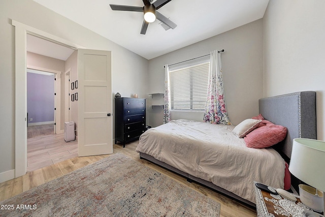 26112 N 7th Ave, Phoenix, AZ 85085 - bedroom featuring light wood finished floors, vaulted ceiling, ceiling fan, and baseboards