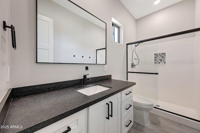 26112 N 7th Ave, Phoenix, AZ 85085 - bathroom with a shower stall, toilet, vanity, and wood finished floors