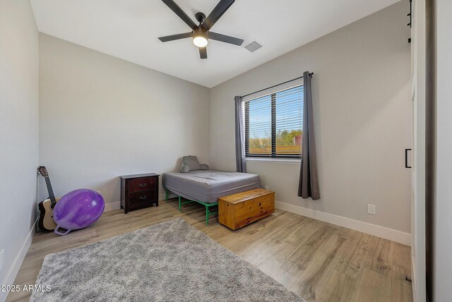 26112 N 7th Ave, Phoenix, AZ 85085 - bedroom with wood finished floors, baseboards, and ceiling fan