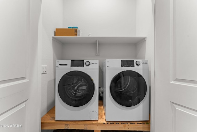 laundry room with separate washer and dryer and laundry area