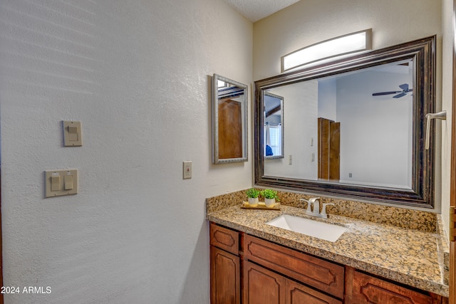 bathroom featuring vanity and ceiling fan