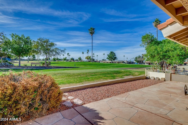 surrounding community featuring a patio area and a yard