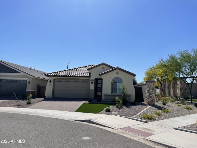 24146 N 162nd Ln, Surprise, AZ 85387 - mediterranean / spanish home featuring stucco siding, a garage, driveway, and a tile roof
