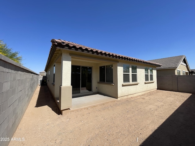 24146 N 162nd Ln, Surprise, AZ 85387 - rear view of property with a patio, a tile roof, a fenced backyard, and stucco siding