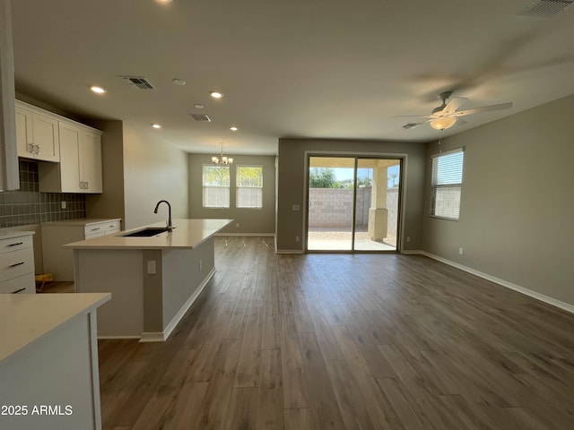 24146 N 162nd Ln, Surprise, AZ 85387 - kitchen with a sink, an island with sink, ceiling fan, dark wood finished floors, and recessed lighting