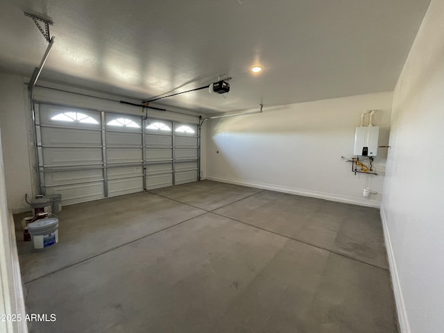 24146 N 162nd Ln, Surprise, AZ 85387 - garage featuring a garage door opener, baseboards, and tankless water heater