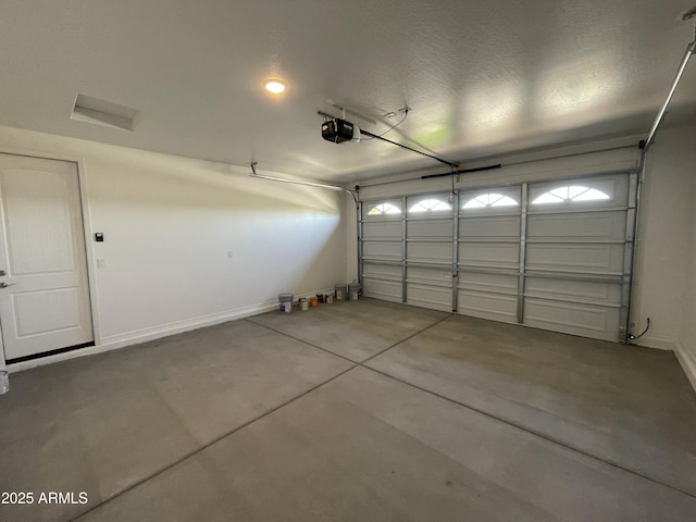 24146 N 162nd Ln, Surprise, AZ 85387 - garage featuring a garage door opener and baseboards