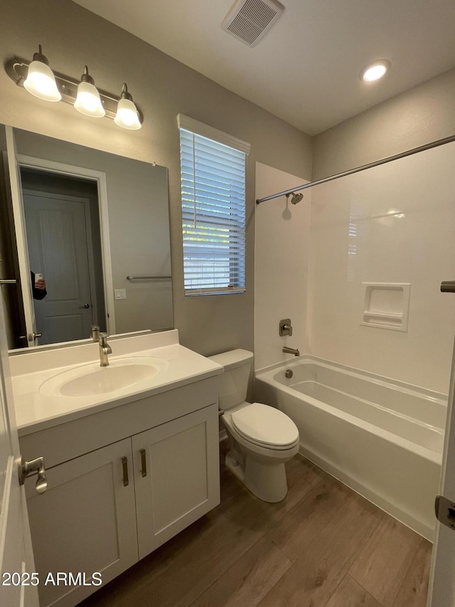 24146 N 162nd Ln, Surprise, AZ 85387 - full bathroom featuring wood finished floors, toilet, vanity, and shower / tub combination