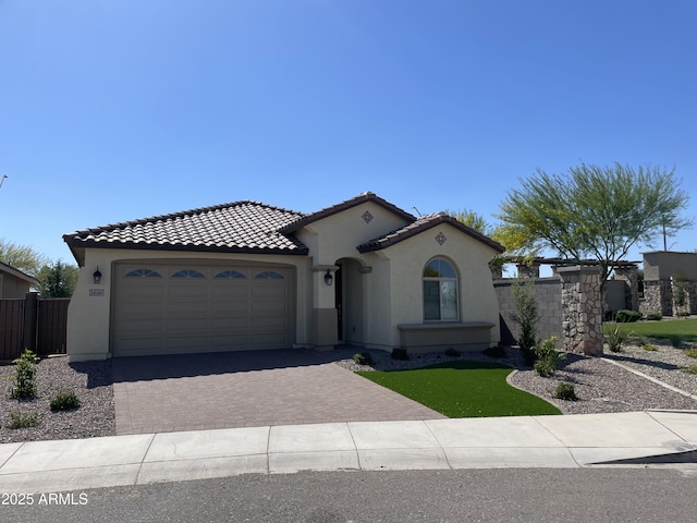 24146 N 162nd Ln, Surprise, AZ 85387 - mediterranean / spanish-style house featuring stucco siding, fence, driveway, a garage, and a tile roof