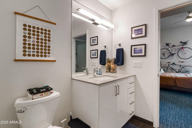 bathroom featuring vanity and toilet