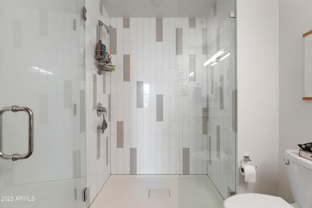 bathroom with walk in shower and toilet