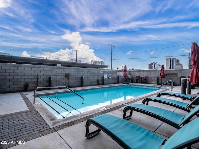 view of swimming pool featuring a patio