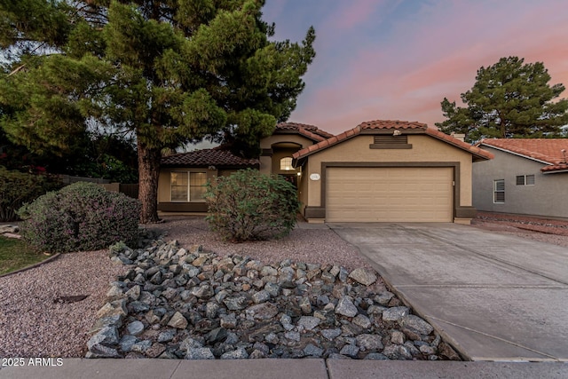 19651 N 34th St, Phoenix, AZ 85050 - mediterranean / spanish home featuring a tiled roof, a garage, driveway, and stucco siding