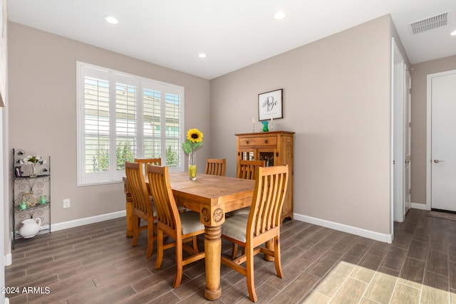 dining area with dark hardwood / wood-style floors