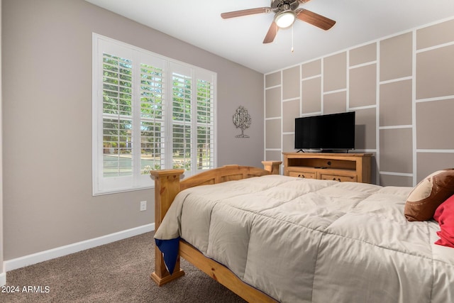 carpeted bedroom with multiple windows and ceiling fan