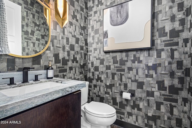 bathroom featuring vanity, tile walls, decorative backsplash, and toilet