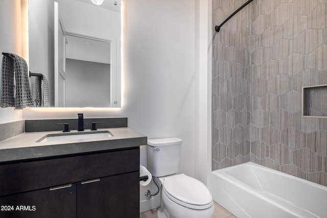 full bathroom with vanity, tiled shower / bath, and toilet