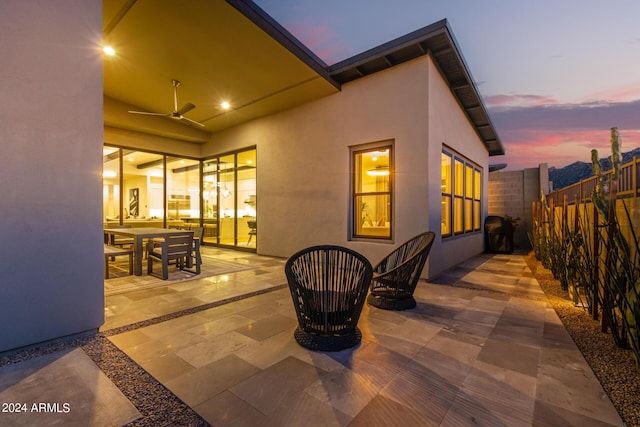 patio terrace at dusk with ceiling fan