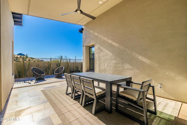 view of patio featuring ceiling fan