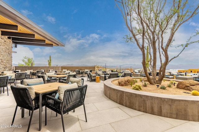 view of patio / terrace featuring a mountain view