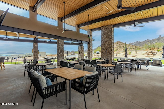 view of patio / terrace featuring a mountain view and ceiling fan