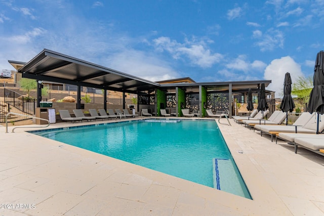 view of swimming pool with a patio area