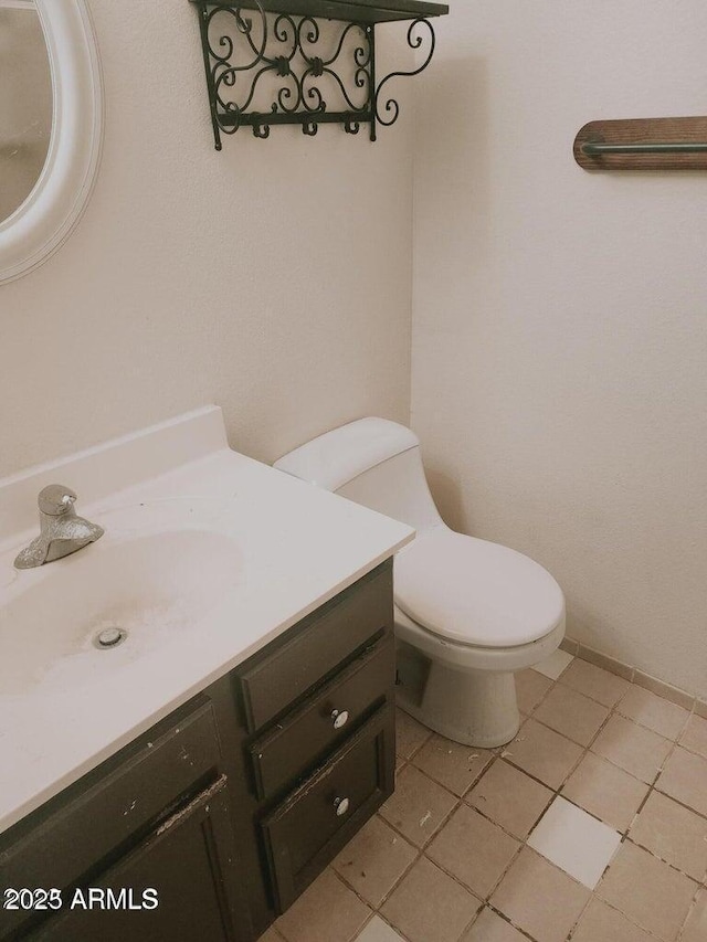 5704 E Aire Libre Ave Unit 1038, Scottsdale, AZ 85254 - half bathroom featuring vanity and tile patterned flooring