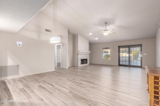 unfurnished living room featuring ceiling fan, light hardwood / wood-style floors, and high vaulted ceiling