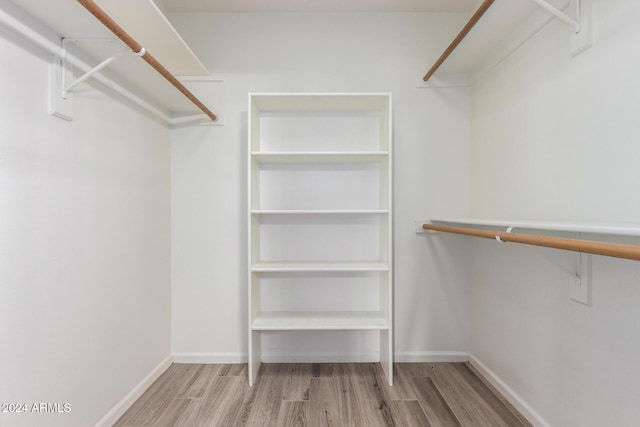 spacious closet with light wood-type flooring