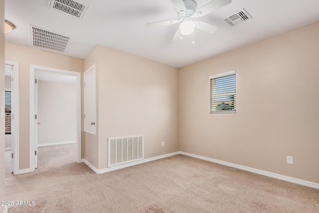unfurnished room with carpet and visible vents