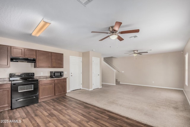 kitchen with a ceiling fan, electric range, baseboards, under cabinet range hood, and visible vents