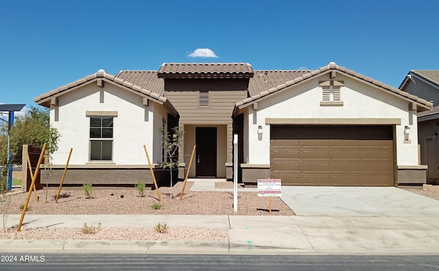 21042 E Camina Buena Vis, Queen Creek, AZ 85142 - view of front of home featuring a tiled roof, an attached garage, driveway, and stucco siding