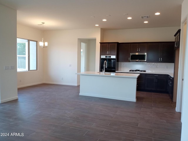 21042 E Camina Buena Vis, Queen Creek, AZ 85142 - kitchen featuring visible vents, a sink, appliances with stainless steel finishes, decorative backsplash, and a chandelier