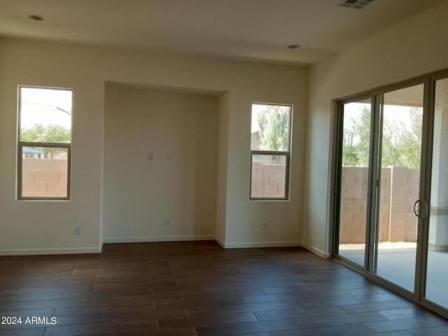 21042 E Camina Buena Vis, Queen Creek, AZ 85142 - unfurnished room with dark wood finished floors, recessed lighting, visible vents, and baseboards