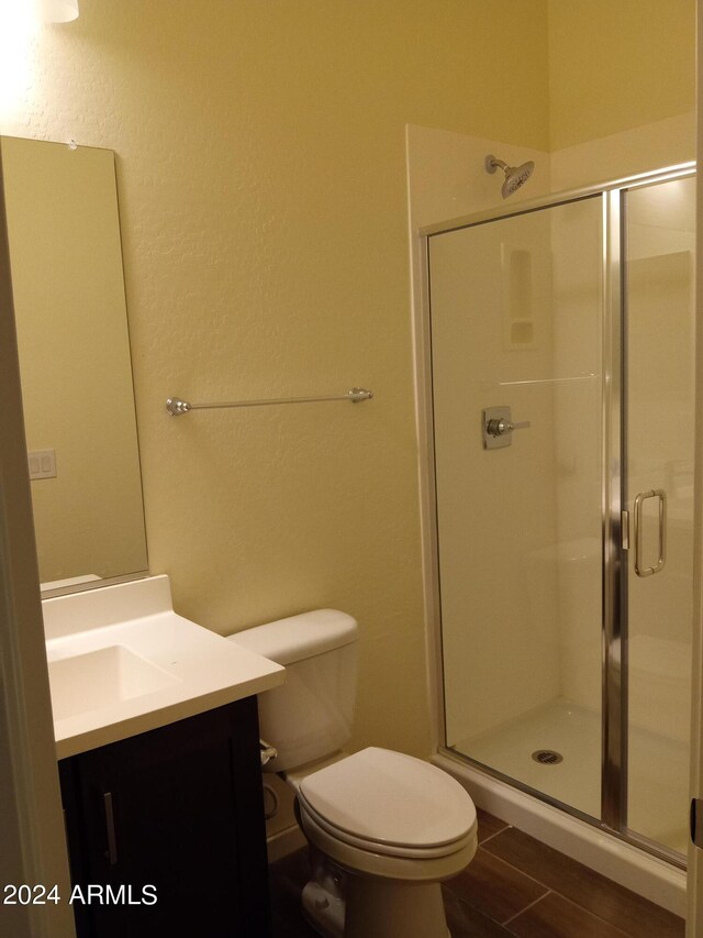 bathroom with shower / washtub combination, hardwood / wood-style floors, and toilet