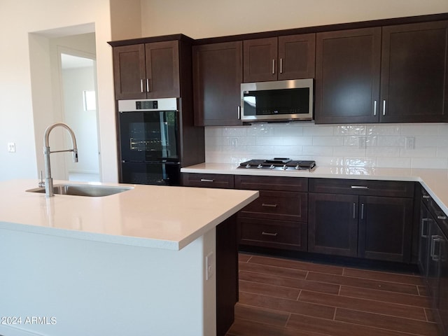 21042 E Camina Buena Vis, Queen Creek, AZ 85142 - kitchen featuring a sink, backsplash, stainless steel appliances, light countertops, and wood tiled floor