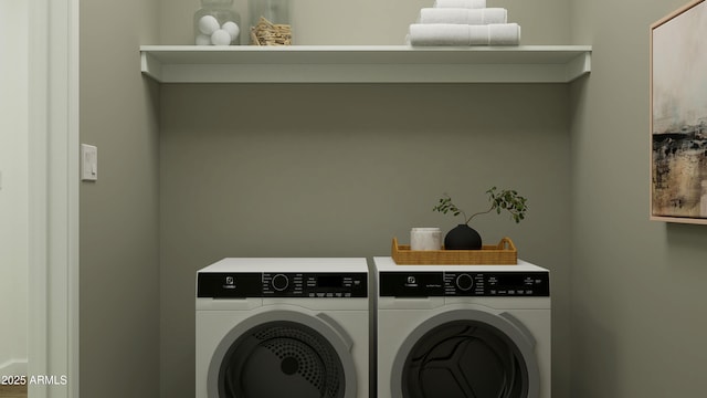 washroom with laundry area and washing machine and clothes dryer