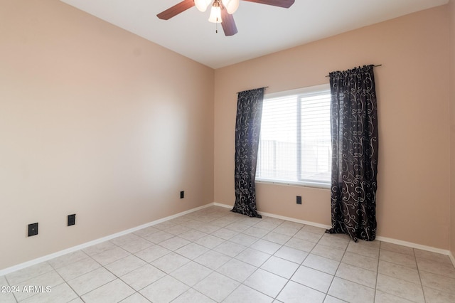 unfurnished room with light tile patterned floors and ceiling fan